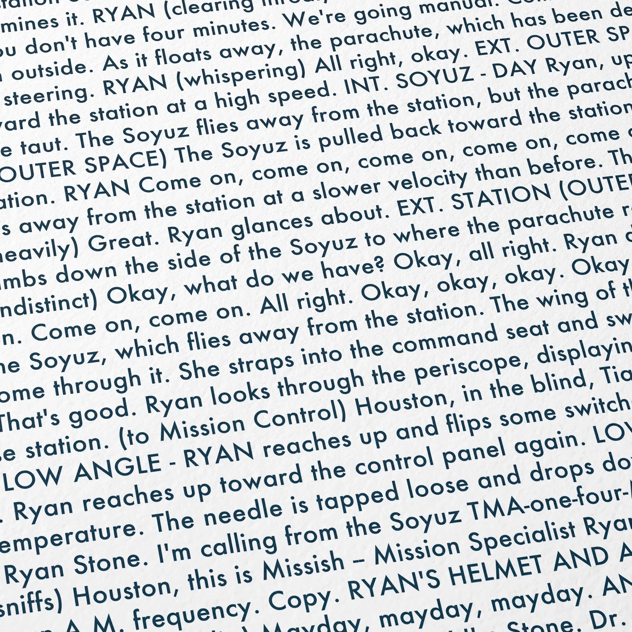 Close-up detail of the Gravity movie script poster showing dense typographic text.