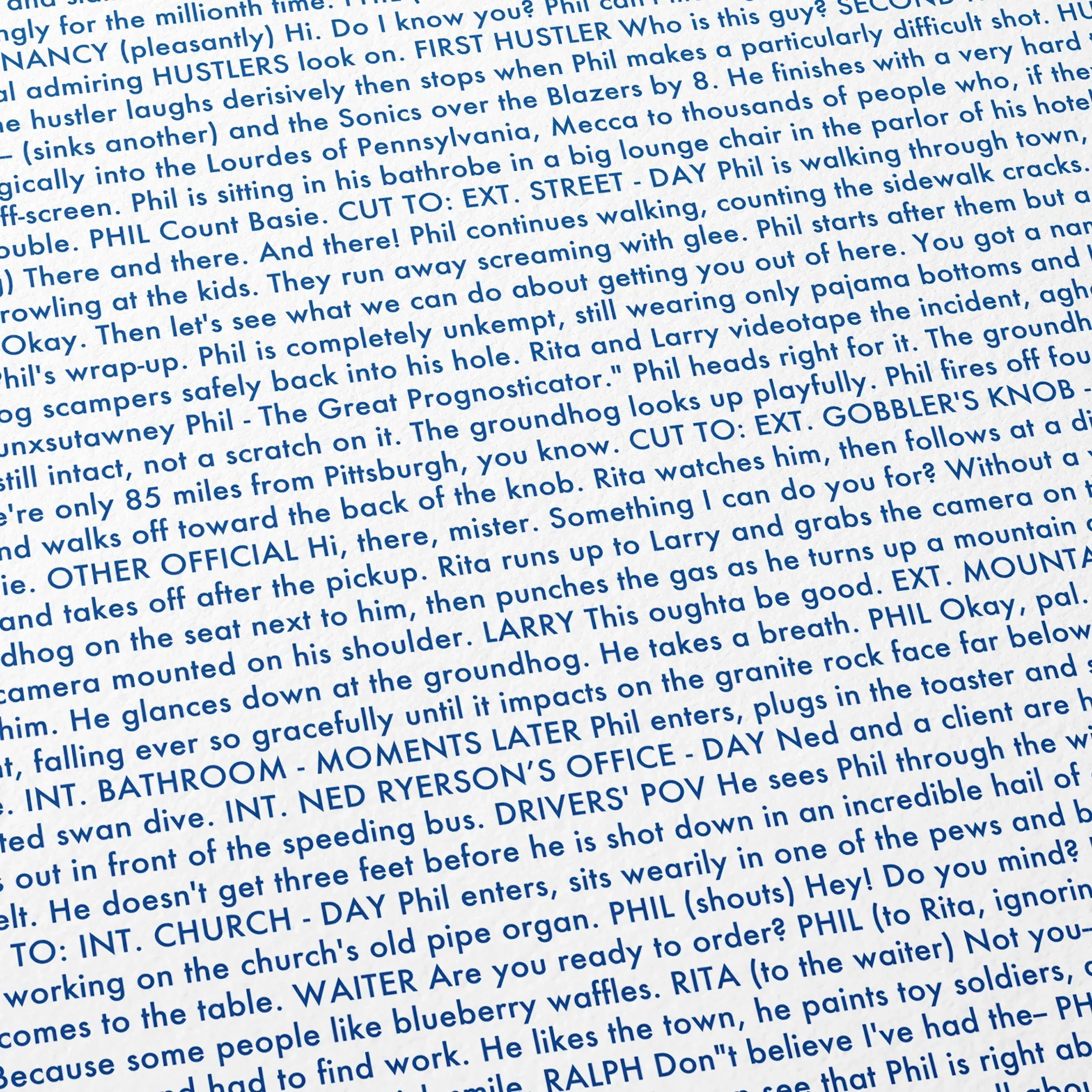 Close-up detail of the Groundhog Day movie script poster showing dense typographic text.