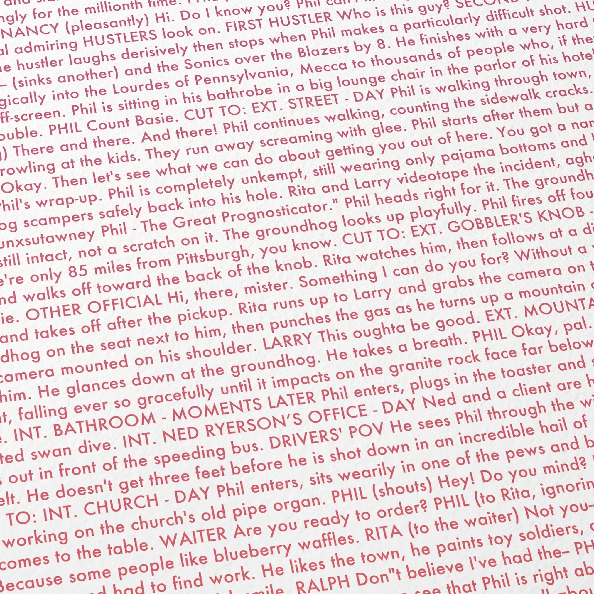 Close-up detail of the Groundhog Day movie script poster showing dense typographic text.