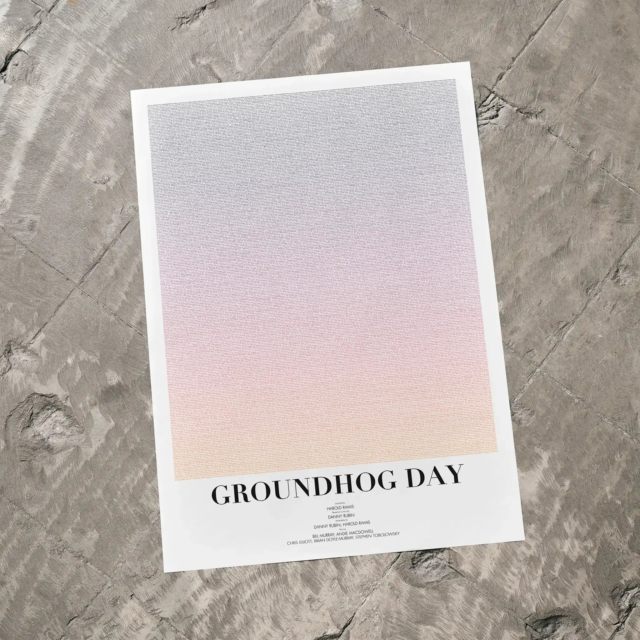 A Groundhog Day movie script poster laid flat on a textured floor surface.