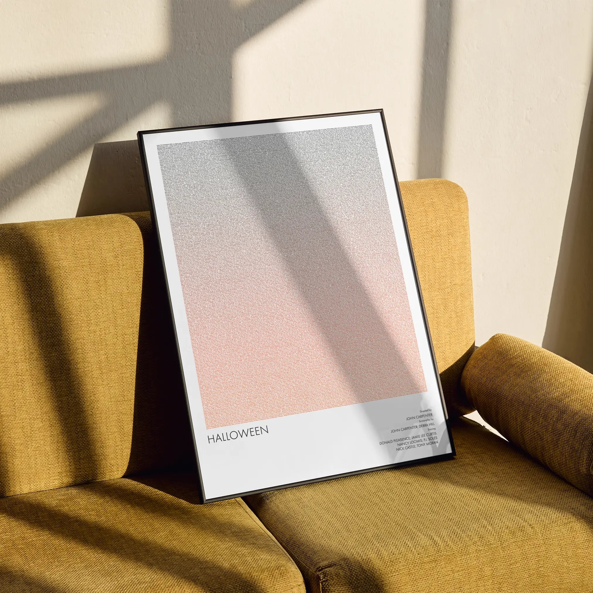 A framed Halloween movie script poster styled in a clean interior setting.