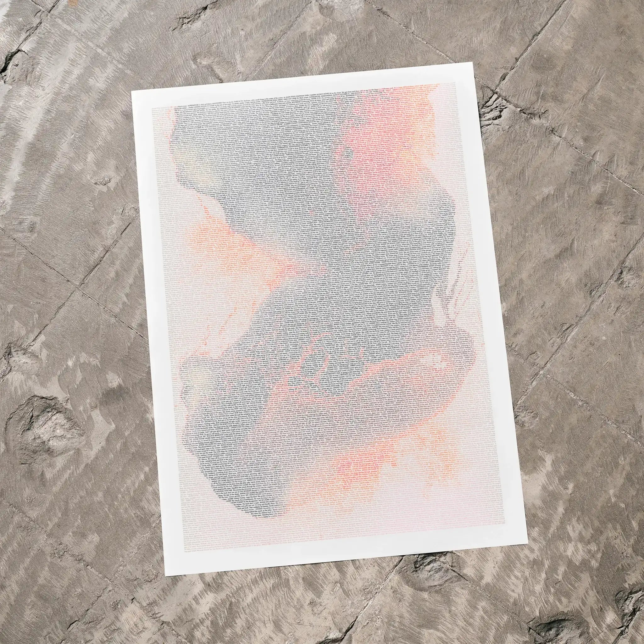 A Halloween movie script poster laid flat on a textured floor surface.