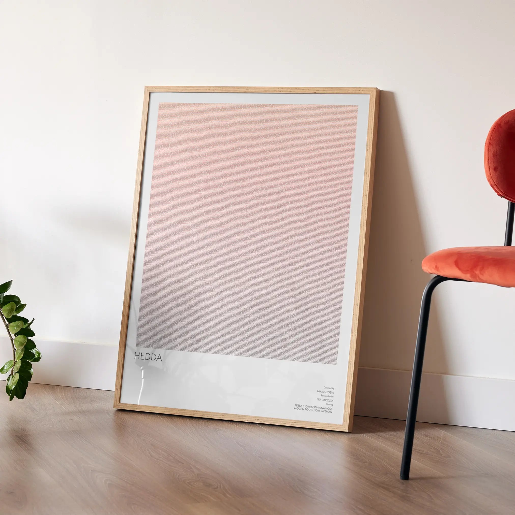 A framed Hedda movie script poster placed in a bright interior environment.