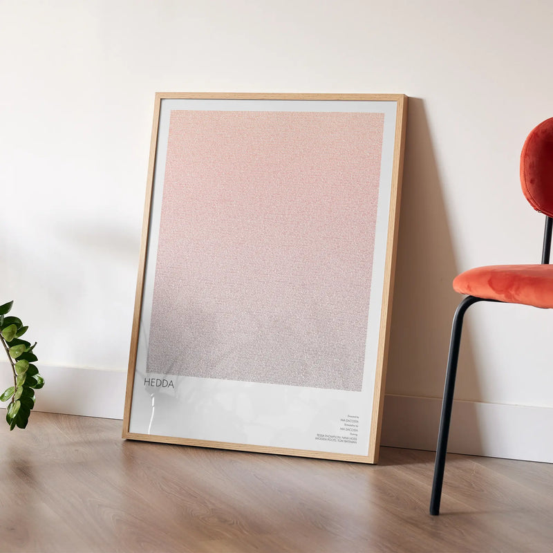 A framed Hedda movie script poster placed in a bright interior environment.