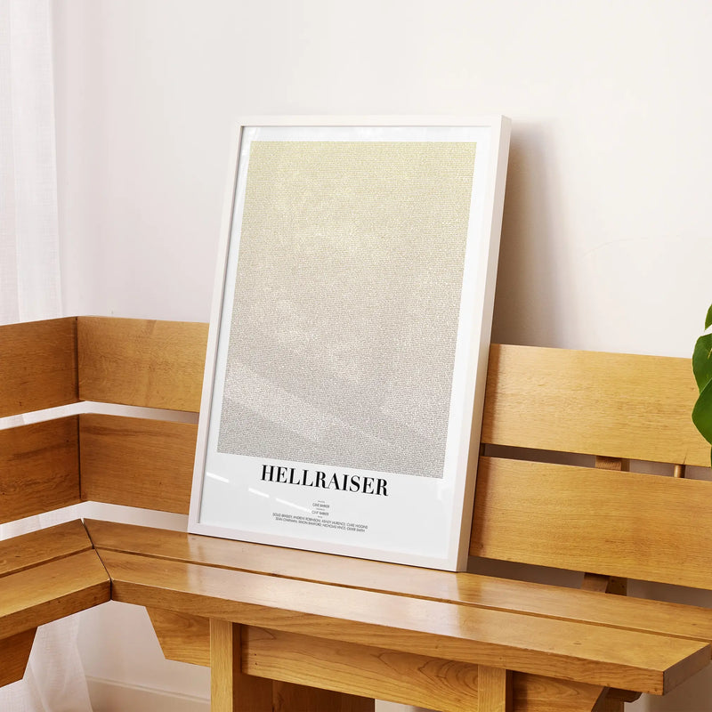 A framed Hellraiser movie script poster displayed on a sideboard in a contemporary space.