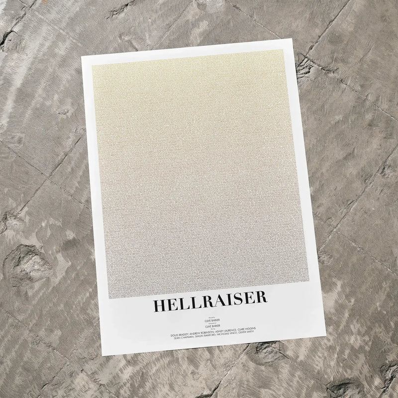 A Hellraiser movie script poster laid flat on a textured floor surface.