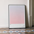 A framed Her movie script poster leaning against a wall in a minimalist interior.