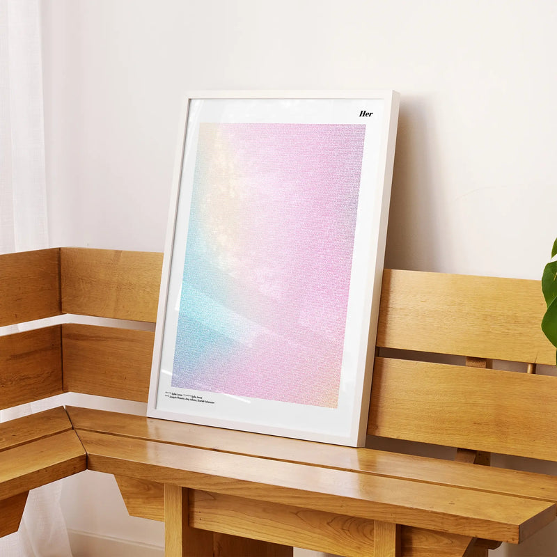 A framed Her movie script poster displayed on a sideboard in a contemporary space.