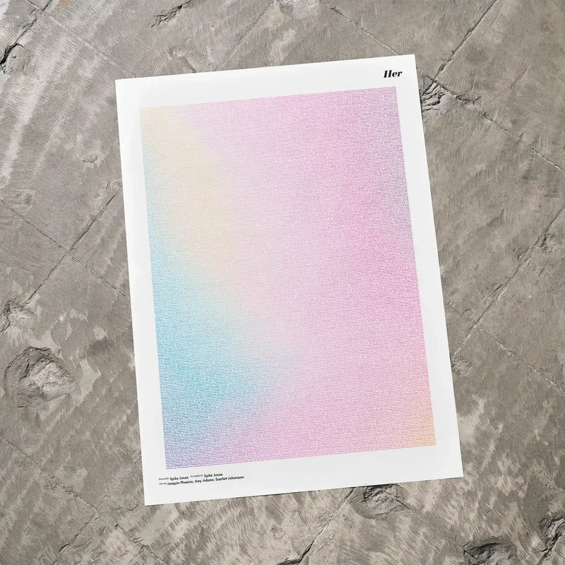 A Her movie script poster laid flat on a textured floor surface.