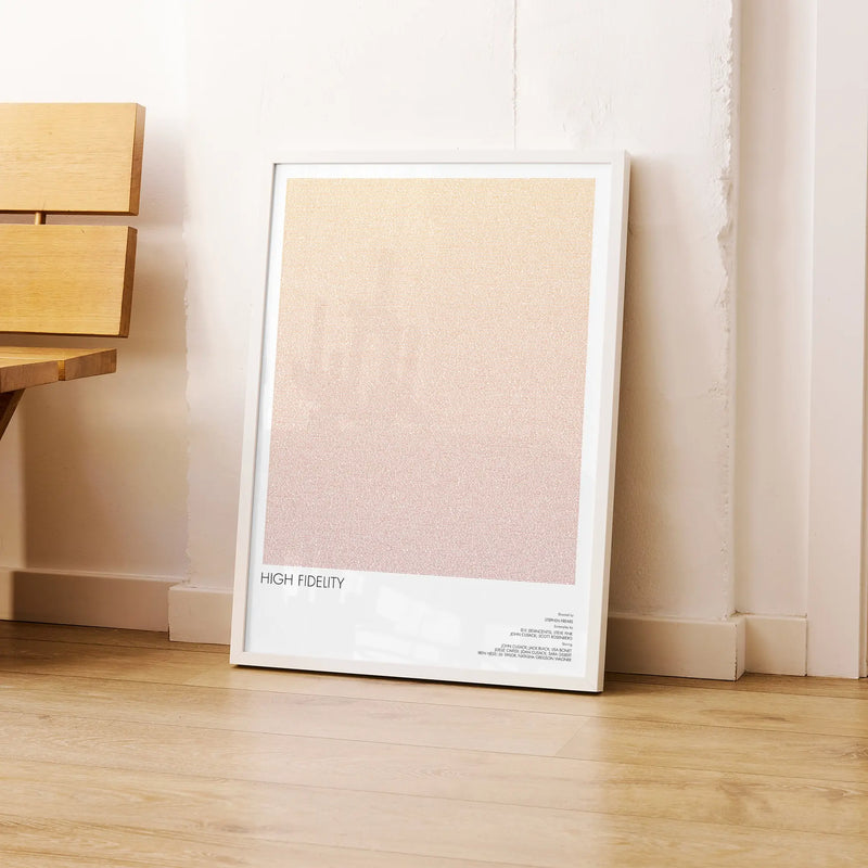 A framed High Fidelity movie script poster leaning against a wall in a modern interior.