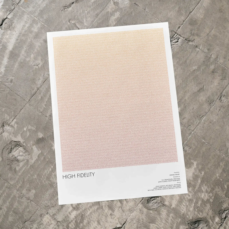 A High Fidelity movie script poster laid flat on a textured floor surface.