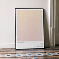 A framed High Fidelity movie script poster leaning against a wall in a minimalist interior.