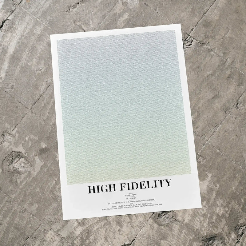A High Fidelity movie script poster laid flat on a textured floor surface.