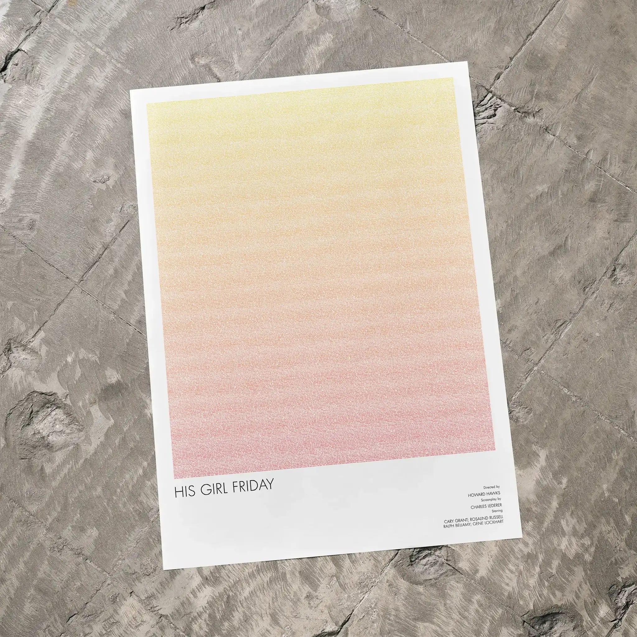 A His Girl Friday movie script poster laid flat on a textured floor surface.
