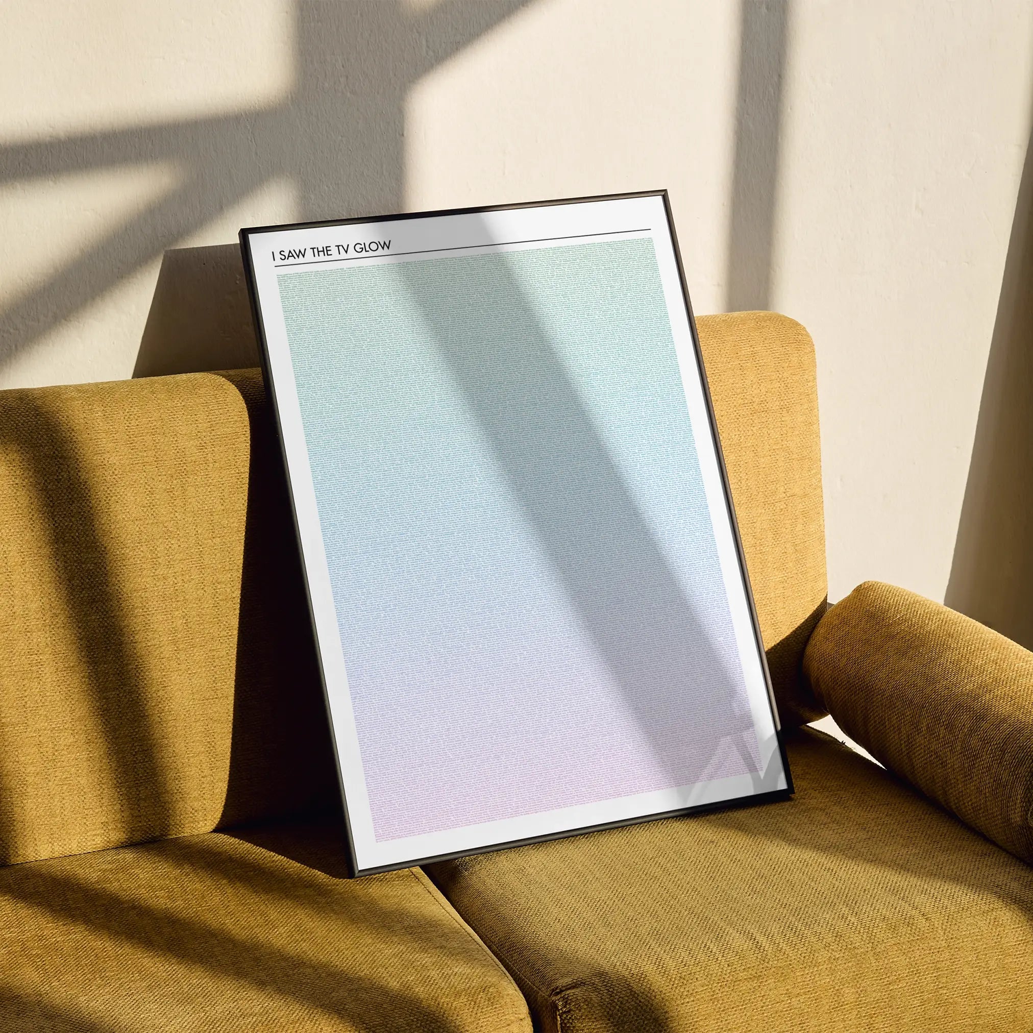 A framed I Saw the TV Glow movie script poster styled in a clean interior setting.