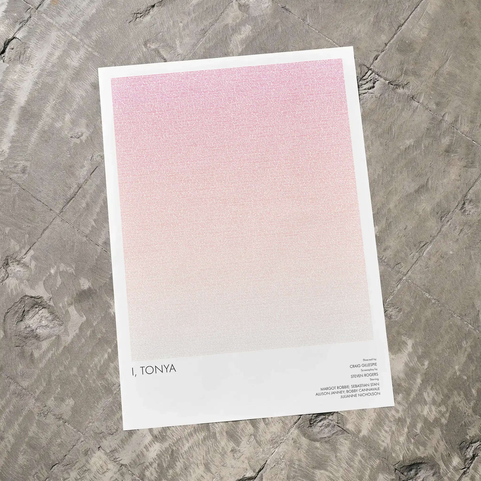 A I, Tonya movie script poster laid flat on a textured floor surface.