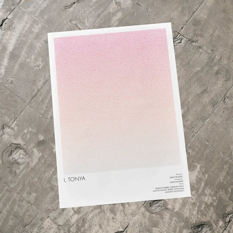 A I, Tonya movie script poster laid flat on a textured floor surface.