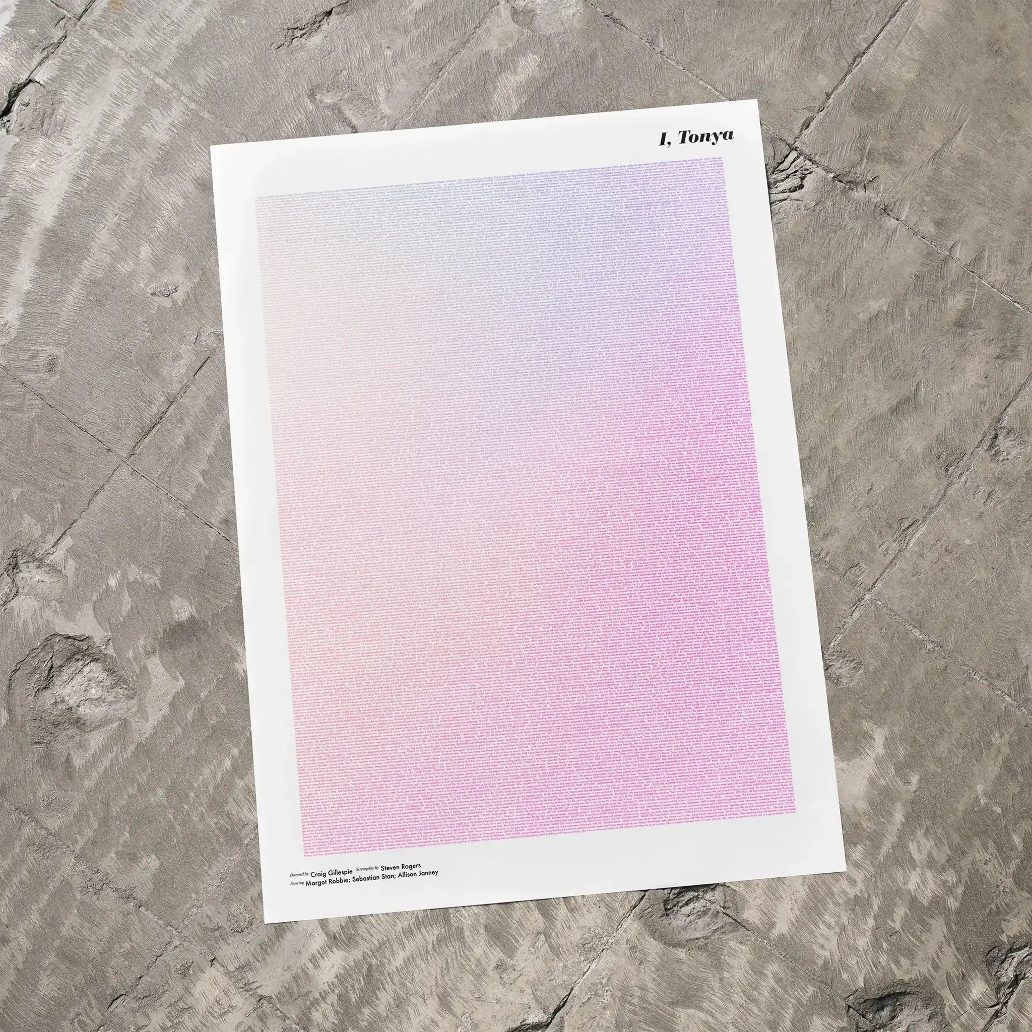 A I, Tonya movie script poster laid flat on a textured floor surface.
