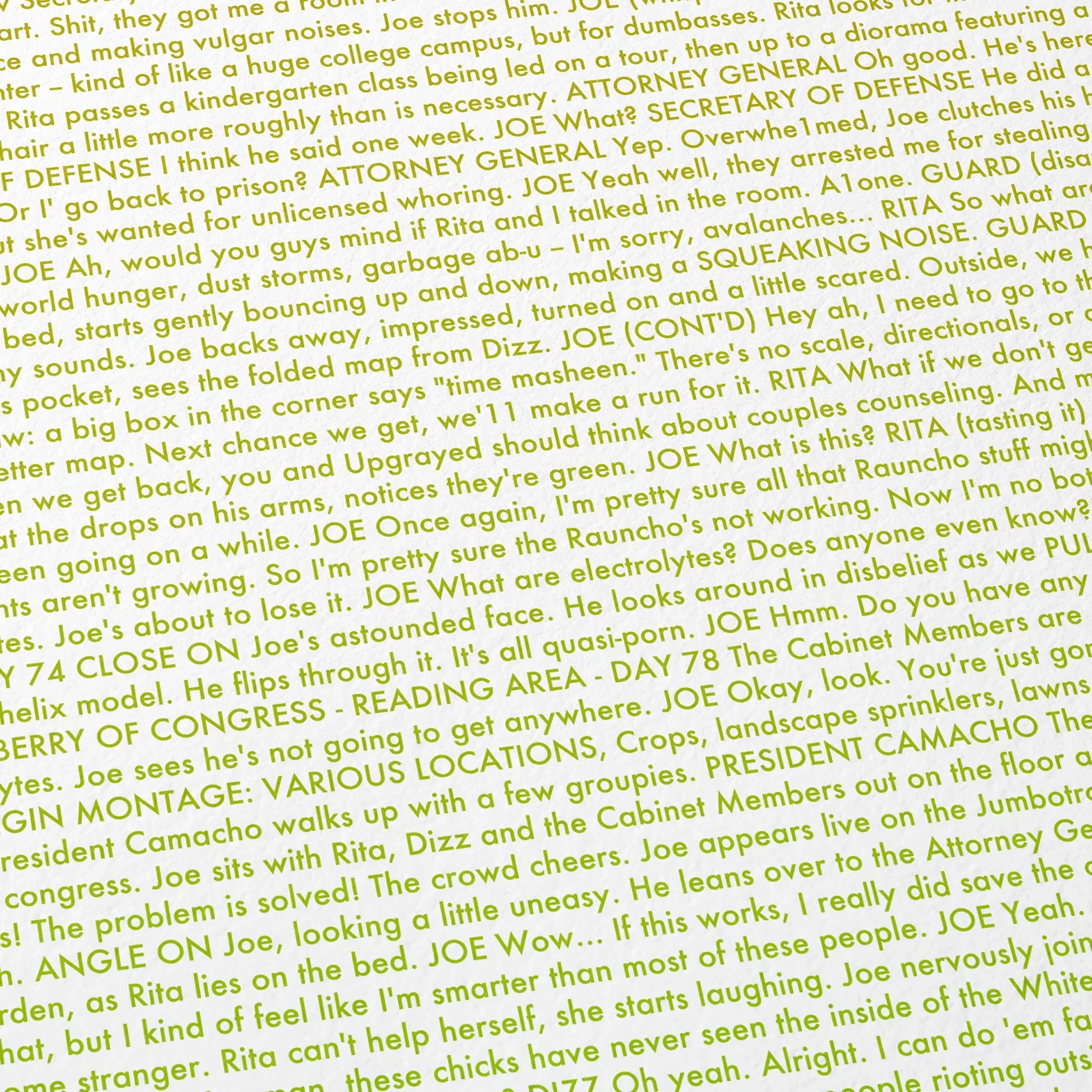 Close-up detail of the Idiocracy movie script poster showing dense typographic text.