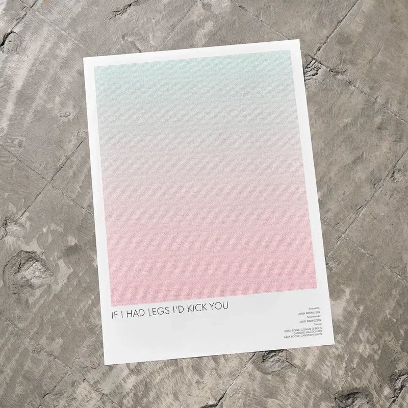 A If I Had Legs I'd Kick You movie script poster laid flat on a textured floor surface.