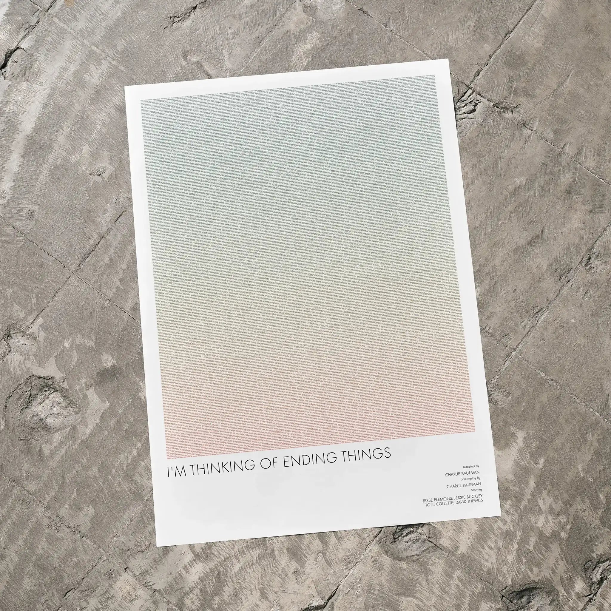A I'm Thinking of Ending Things movie script poster laid flat on a textured floor surface.