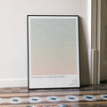 A framed I'm Thinking of Ending Things movie script poster leaning against a wall in a minimalist interior.