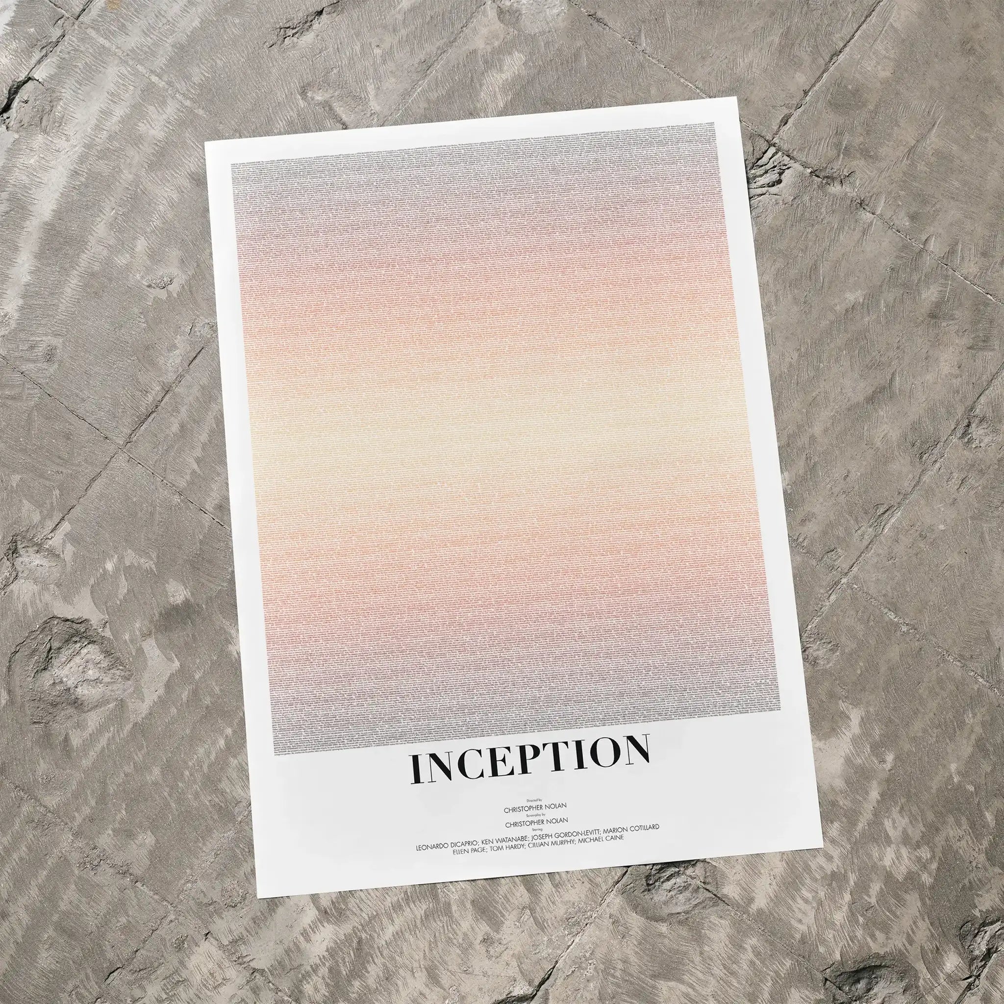 Poster with gradient design and 'Inception' text on a textured surface