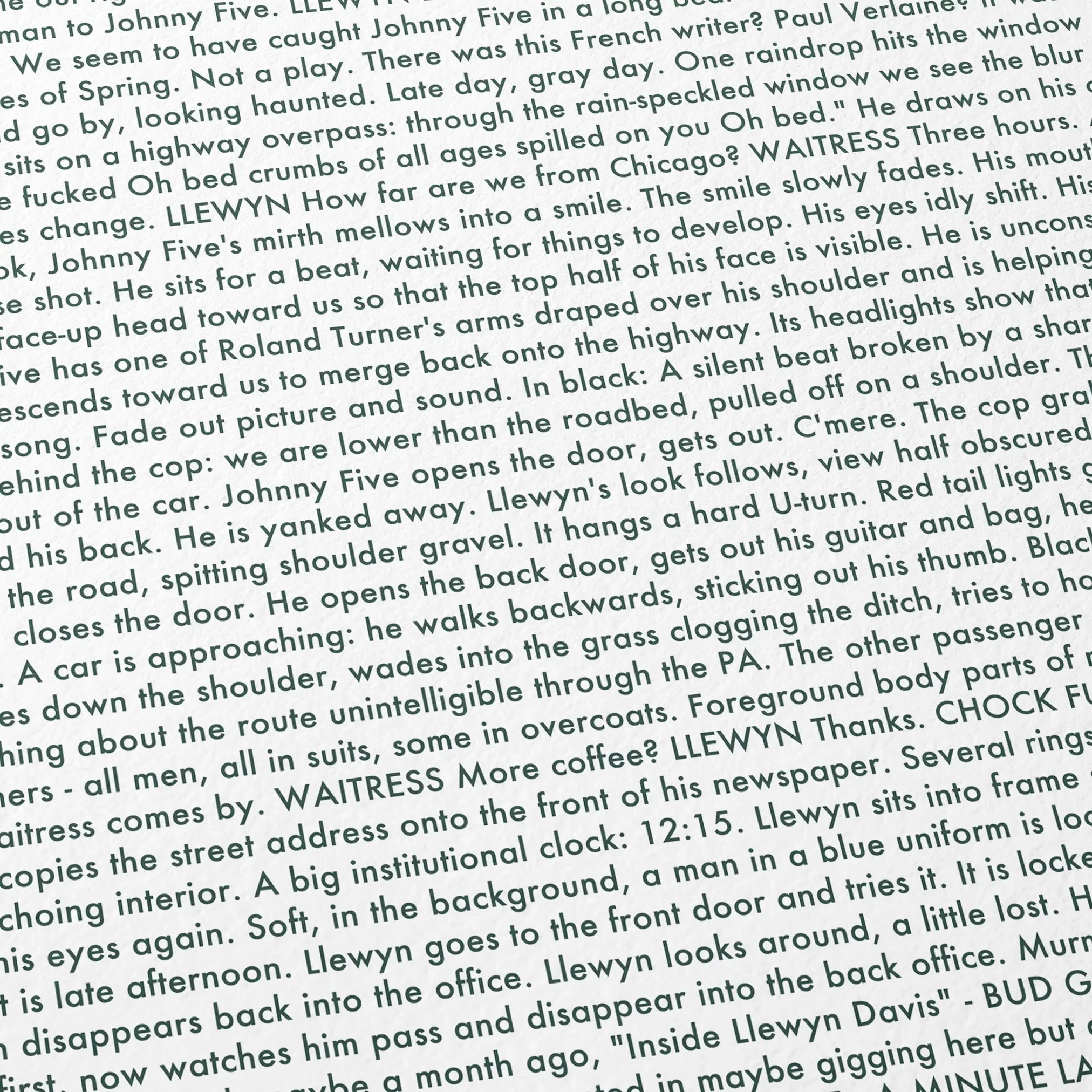 Close-up detail of the Inside Llewyn Davis movie script poster showing dense typographic text.
