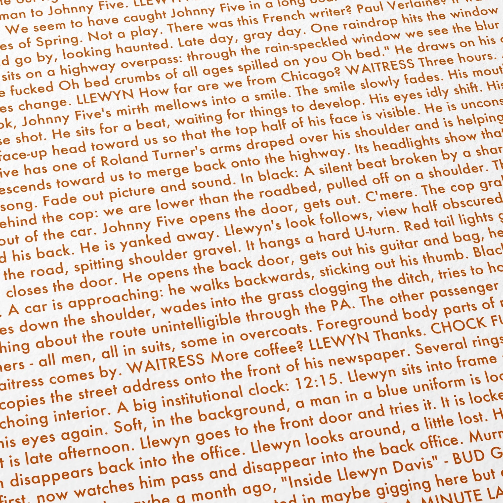 Close-up detail of the Inside Llewyn Davis movie script poster showing dense typographic text.