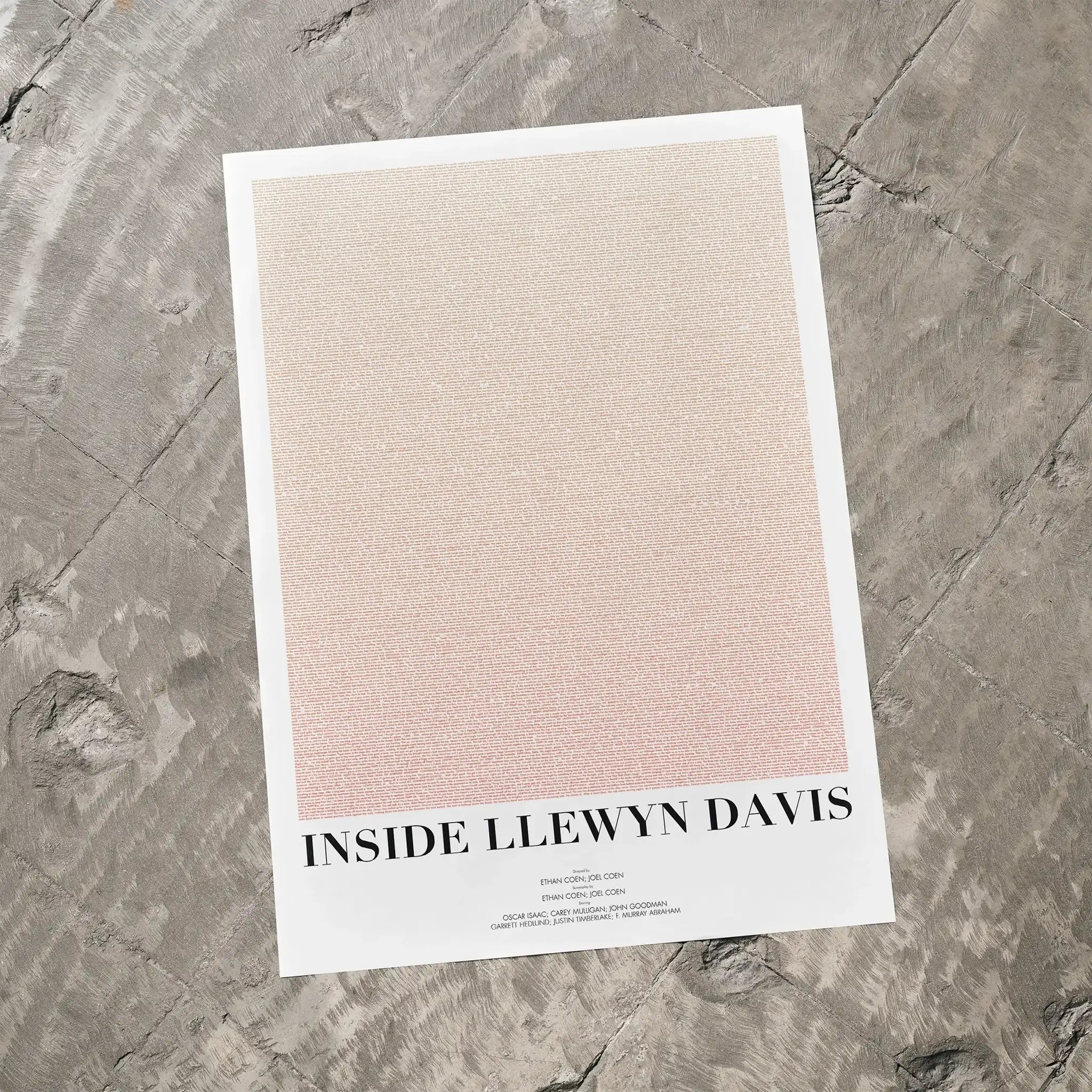 A Inside Llewyn Davis movie script poster laid flat on a textured floor surface.