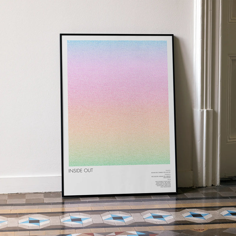 A framed Inside Out movie script poster leaning against a wall in a minimalist interior.