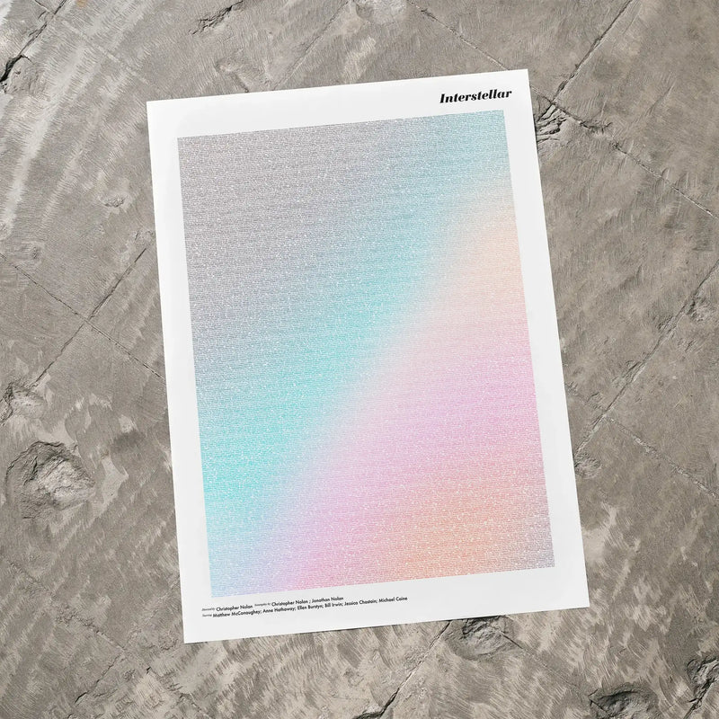 A Interstellar movie script poster laid flat on a textured floor surface.