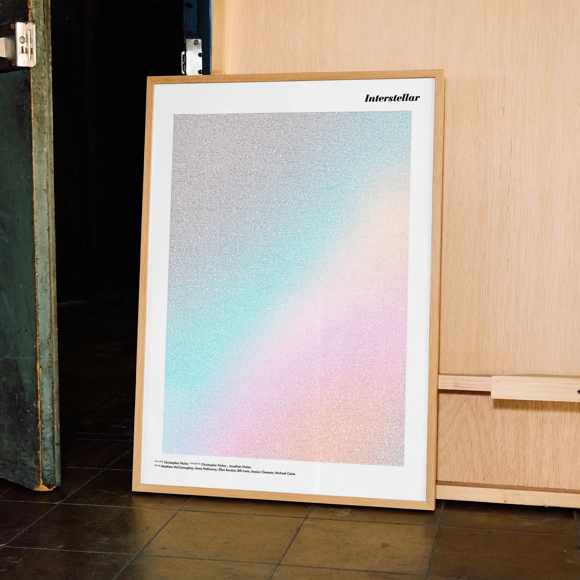 A framed Interstellar movie script poster displayed in a contemporary interior setting.