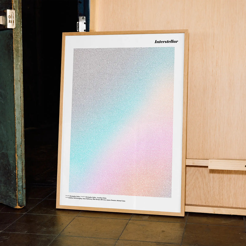 A framed Interstellar movie script poster displayed in a contemporary interior setting.