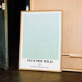 A framed Into the Wild movie script poster displayed in a contemporary interior setting.