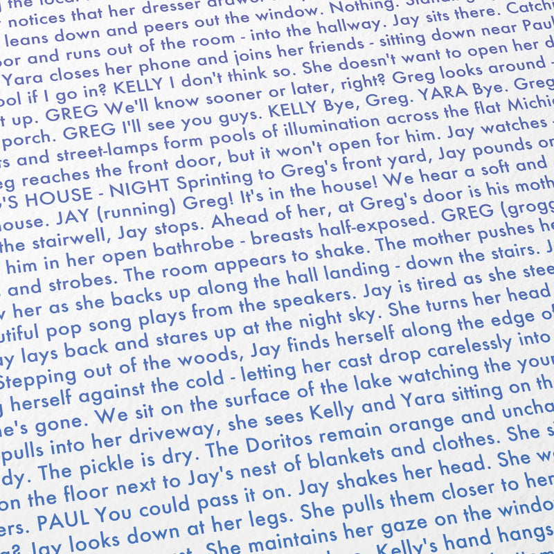 Close-up detail of the It Follows movie script poster showing dense typographic text.