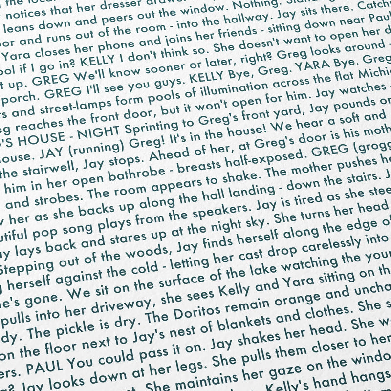 Close-up detail of the It Follows movie script poster showing dense typographic text.