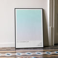 A framed It's a Wonderful Life movie script poster leaning against a wall in a minimalist interior.