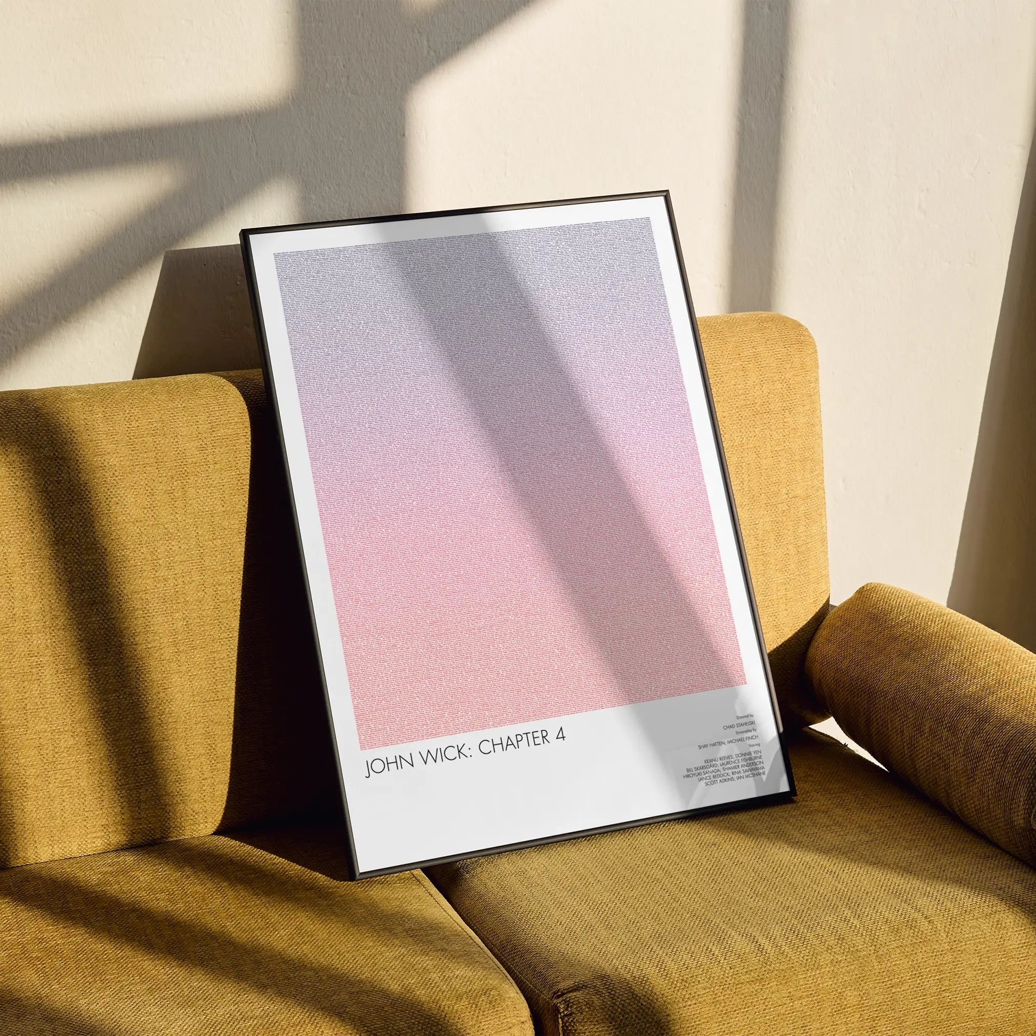 A framed John Wick: Chapter 4 movie script poster styled in a clean interior setting.