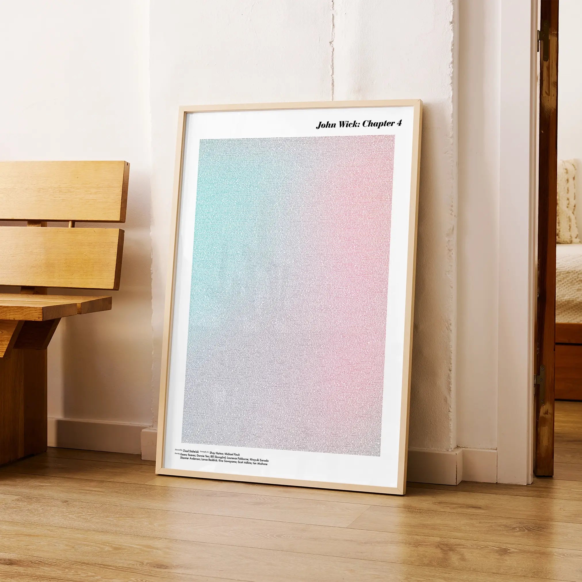 A framed John Wick: Chapter 4 movie script poster arranged in a minimalist interior setting.