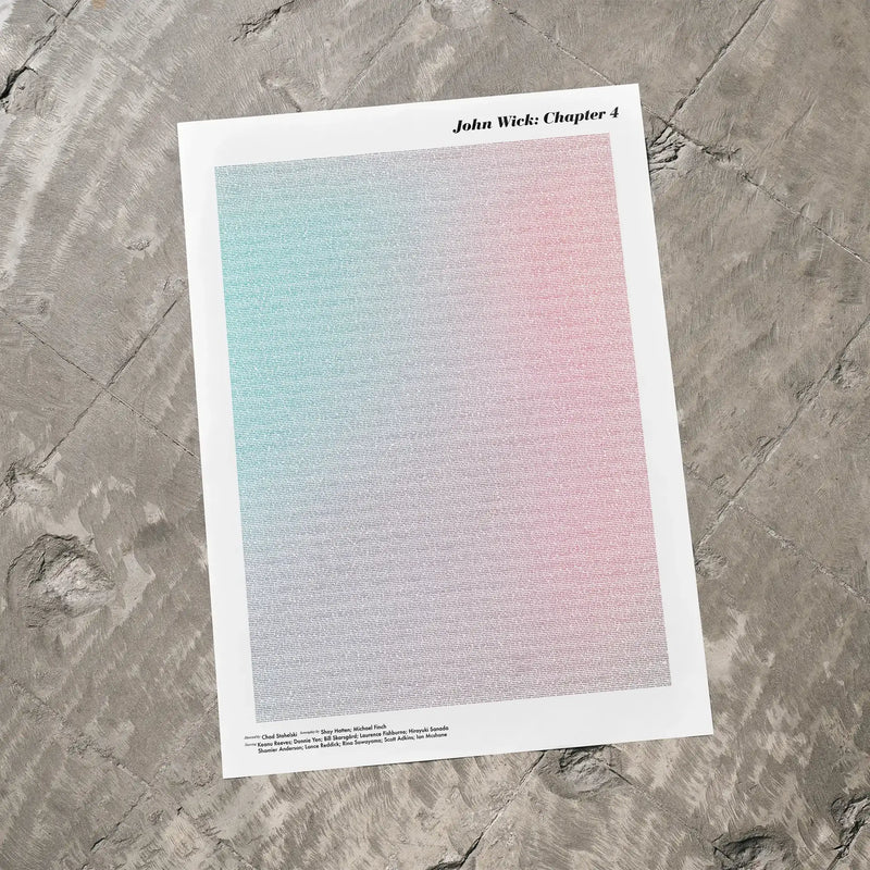 A John Wick: Chapter 4 movie script poster laid flat on a textured floor surface.