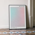A framed John Wick: Chapter 4 movie script poster leaning against a wall in a minimalist interior.