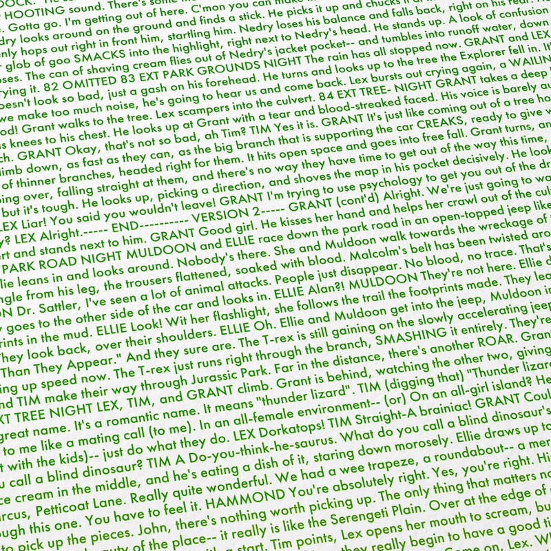 Close-up detail of the Jurassic Park movie script poster showing dense typographic text.