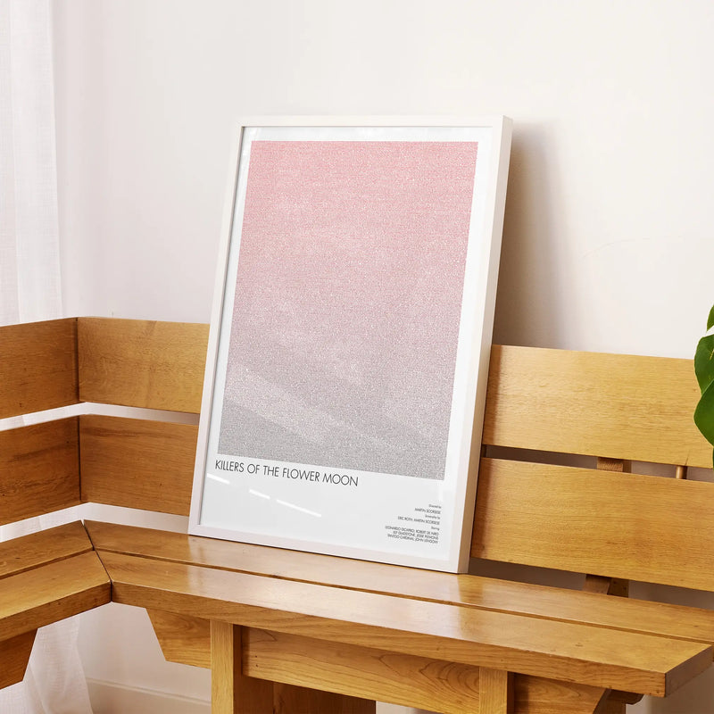 A framed Killers of the Flower Moon movie script poster displayed on a sideboard in a contemporary space.