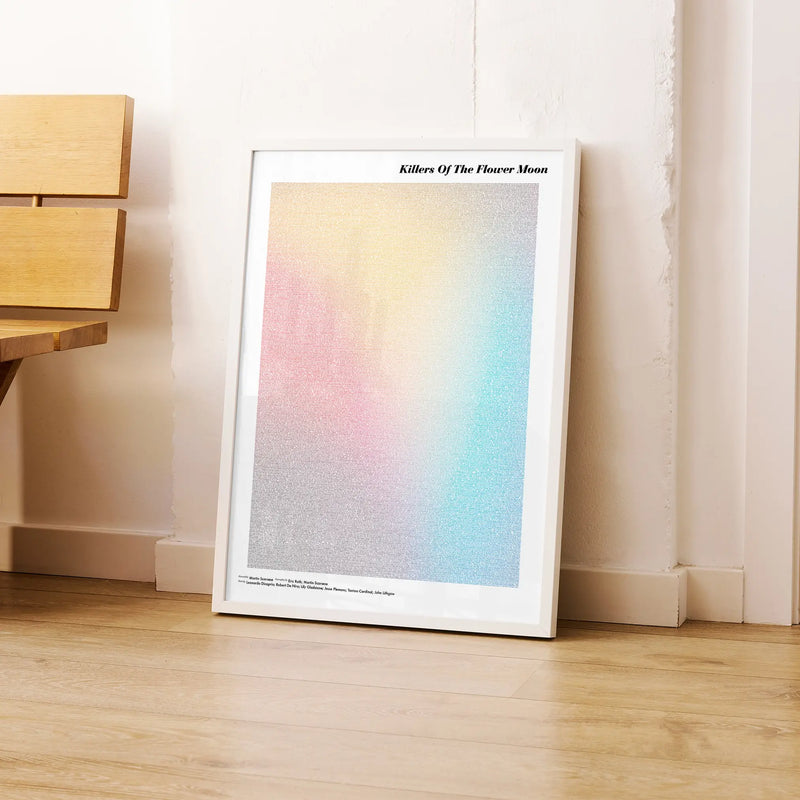 A framed Killers of the Flower Moon movie script poster leaning against a wall in a modern interior.