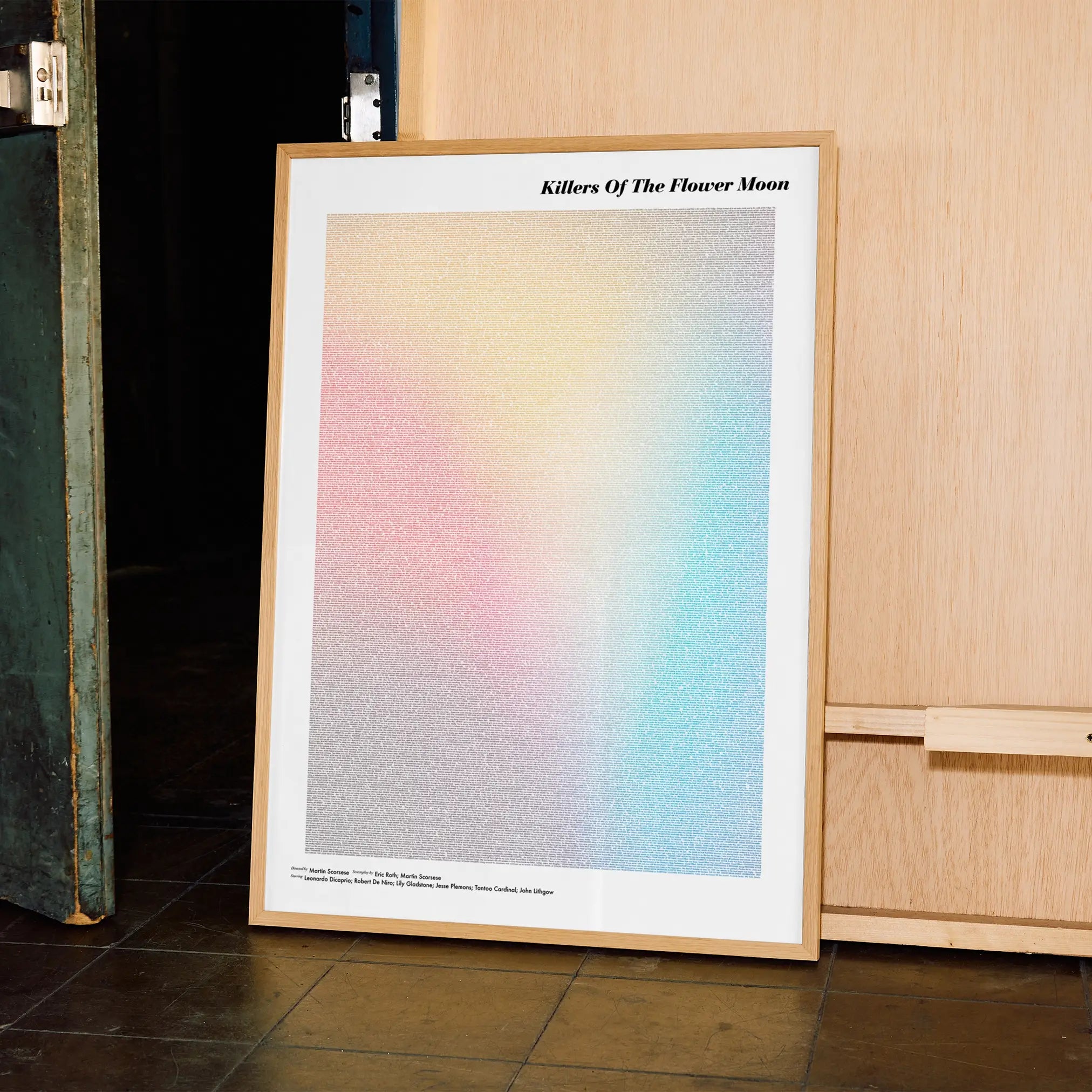 A framed Killers of the Flower Moon movie script poster displayed in a contemporary interior setting.