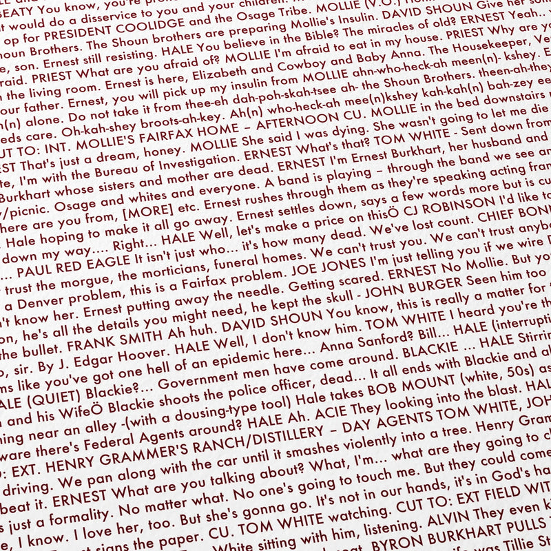 Close-up detail of the Killers of the Flower Moon movie script poster showing dense typographic text.