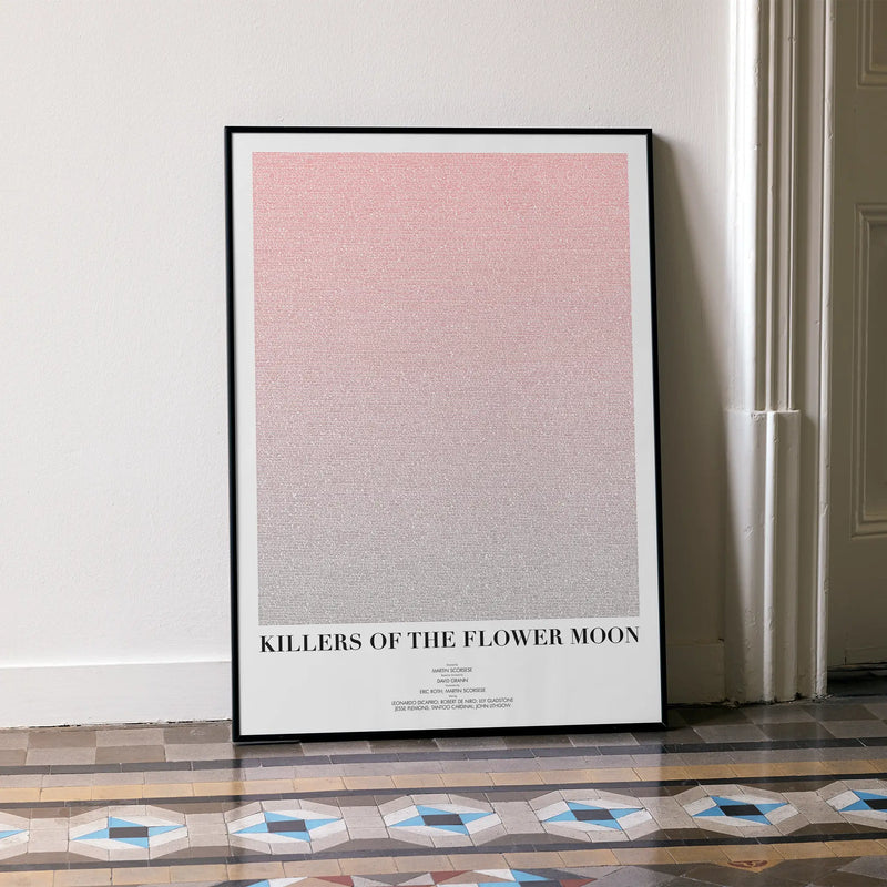 A framed Killers of the Flower Moon movie script poster leaning against a wall in a minimalist interior.