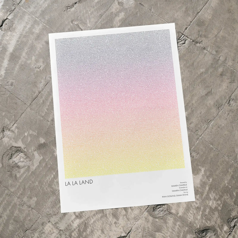 A La La Land movie script poster laid flat on a textured floor surface.