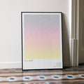 A framed La La Land movie script poster leaning against a wall in a minimalist interior.